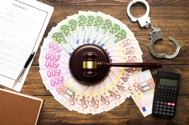 Free photo arrangement with money, gavel, calculator and contract