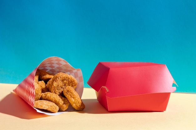 Free photo arrangement with nuggets and red box