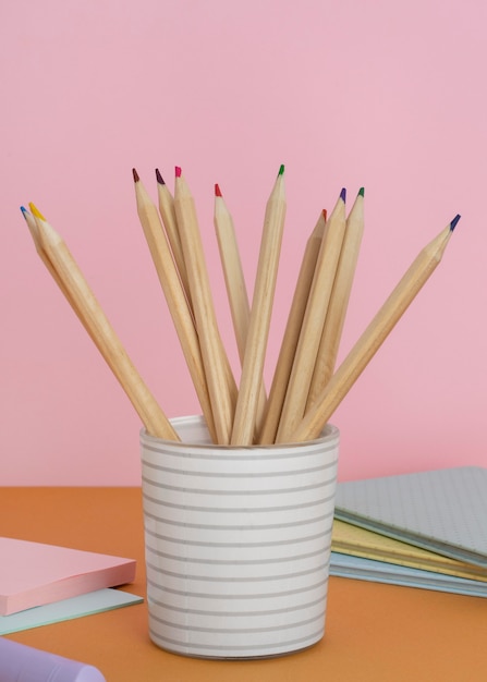 Free photo arrangement with pencils in cup