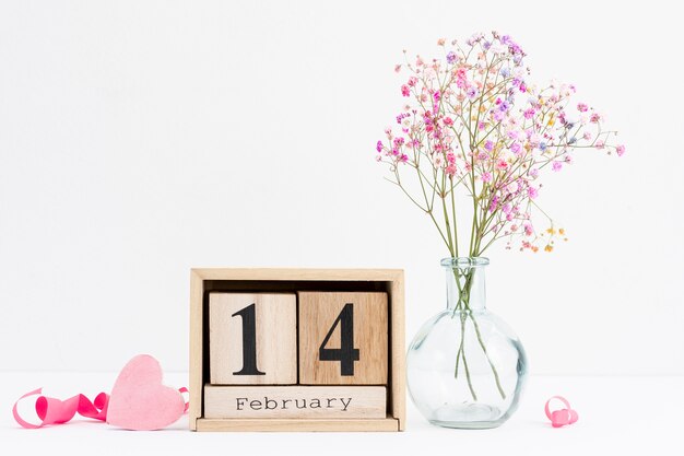 Arrangement with pink ribbon and flower vase