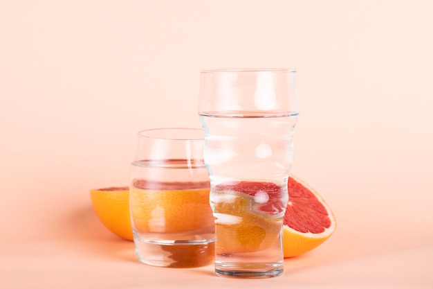 Arrangement with red orange and glasses of water