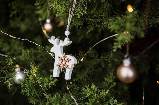 Free Photo arrangement with reindeer shaped christmas tree decoration