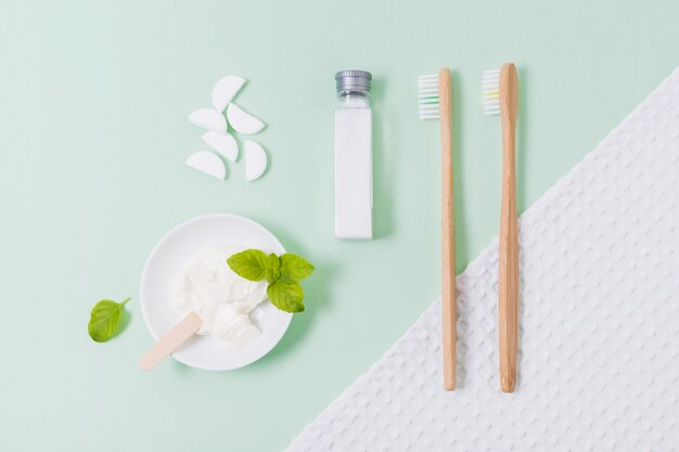 Arrangement of zero waste products on green background