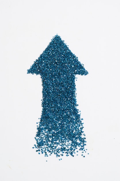 Free photo arrow pointing up made out of glitter