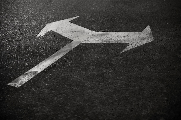 Free Photo arrow sign on the road in the city