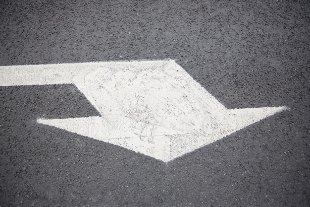 Arrow sign on road surface