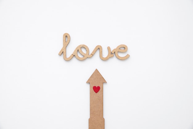 Free Photo arrow with heart pointing at love writing