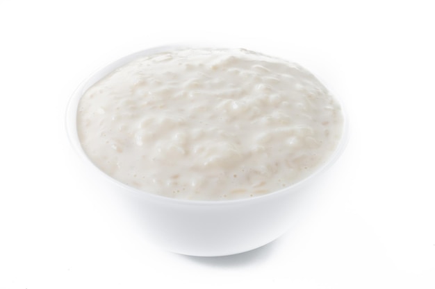 Free photo arroz con leche rice pudding with cinnamon isolated on white background