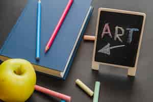 Free photo art book on blackboard