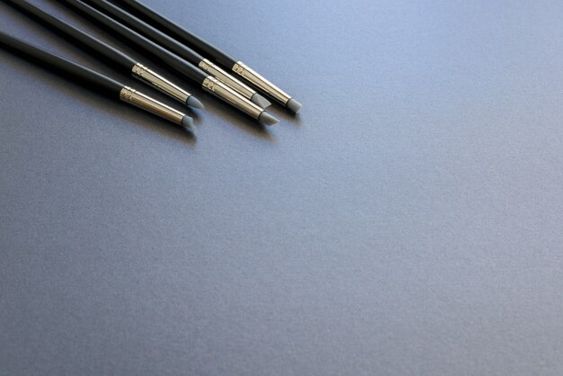 Art supply silicone tip pen isolated on dark grey background.