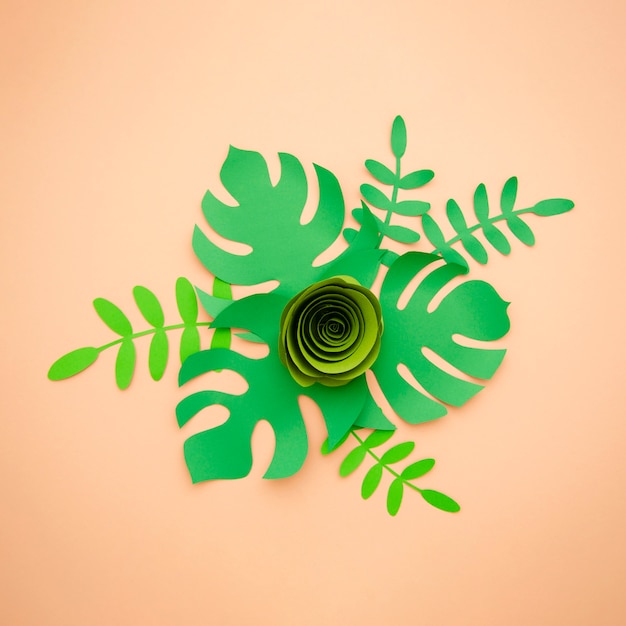 Free photo artificial leaves paper cut style and green rose