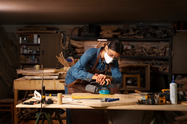 Free Photo artisan doing woodcutting medium shot