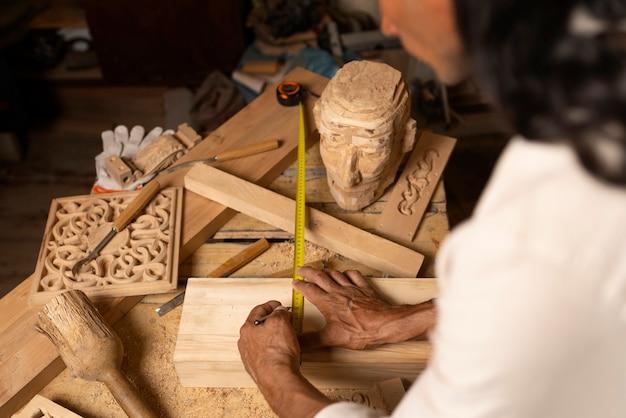 Free Photo artisan doing woodcutting