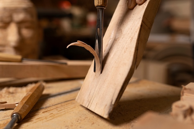 Free Photo artisan doing woodcutting