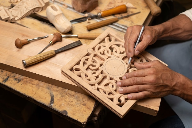 Free photo artisan doing woodcutting