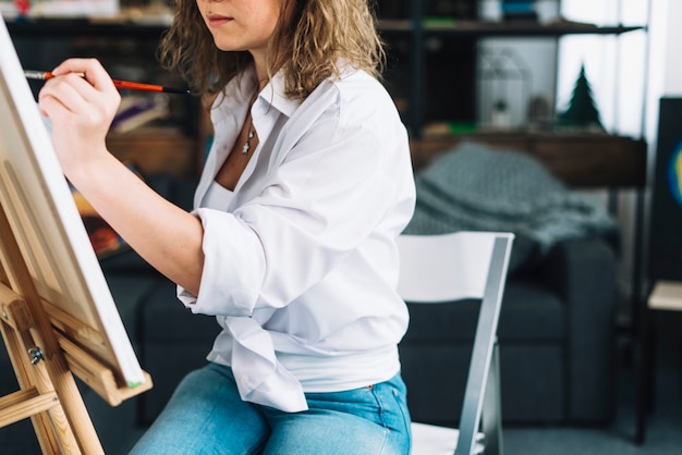 Artist painting on canvas