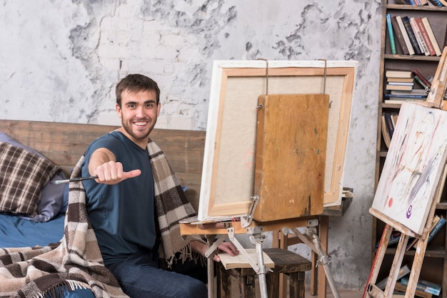 Artist painting in studio