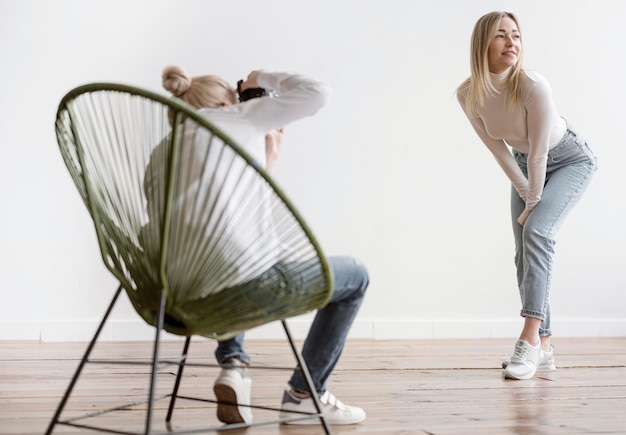 Artist sitting on a chair and taking photos