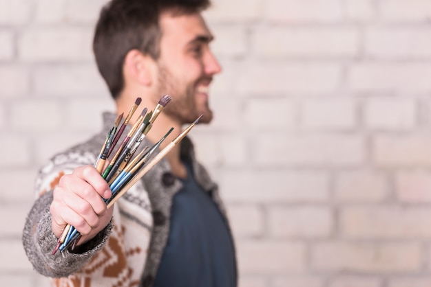 Artist with brushes