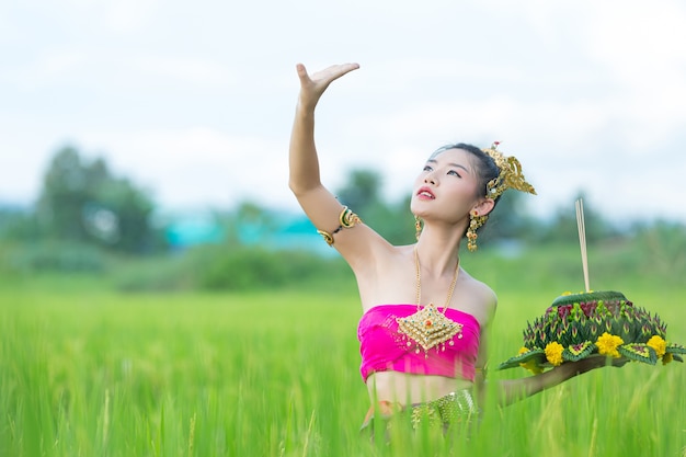 Asia woman in Thai dress traditional hold kratong. Loy krathong festival