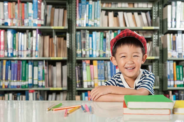 Asian Boy in library room school