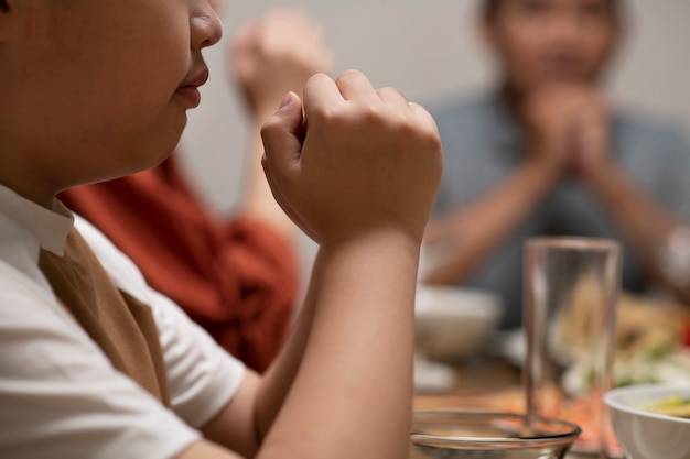 Asian family eating together