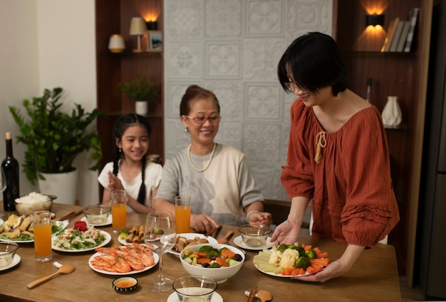 Free photo asian family eating together