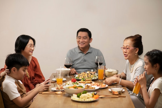 Asian family eating together