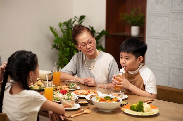 Asian family eating together