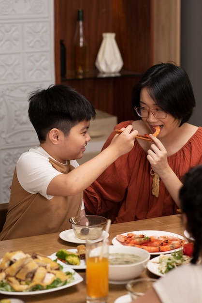 Asian family eating together