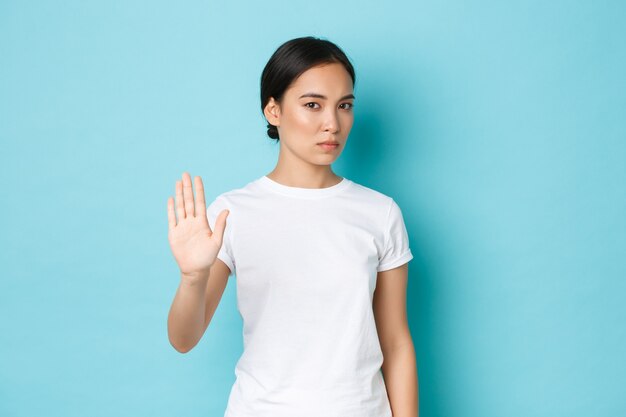 Asian female in casual T-shirt posing