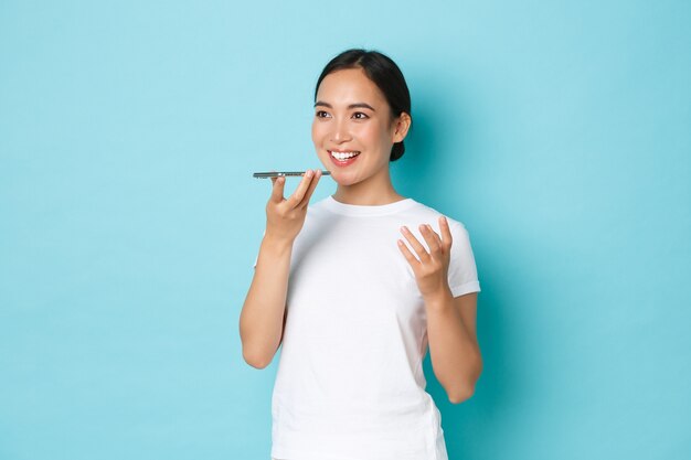 Asian female in casual T-shirt posing