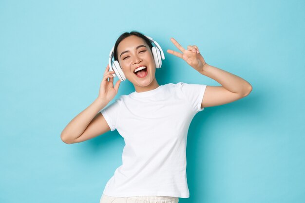 Asian female in casual T-shirt posing