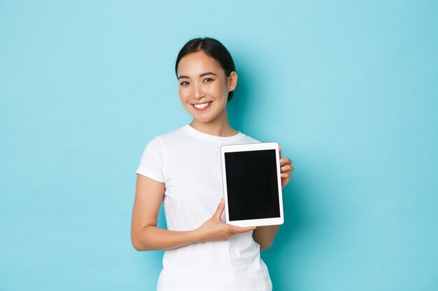 Asian female in casual T-shirt posing