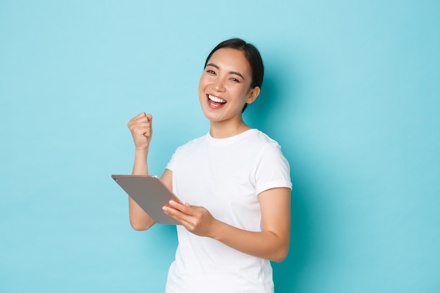 Asian female in casual T-shirt posing