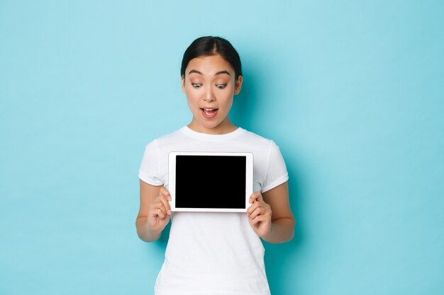 Asian female in casual T-shirt posing