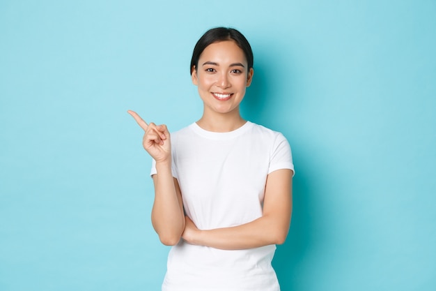 Asian female in casual T-shirt posing