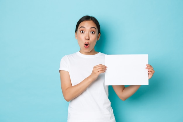 Asian female in casual T-shirt posing