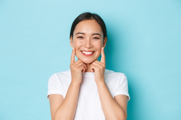 Asian female in casual T-shirt posing