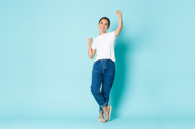 Asian female in casual T-shirt posing