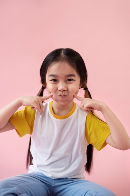 Free photo asian girl making gesture