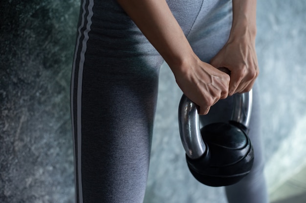 Free Photo asian girls are exercising with the kettlebell in the gym.