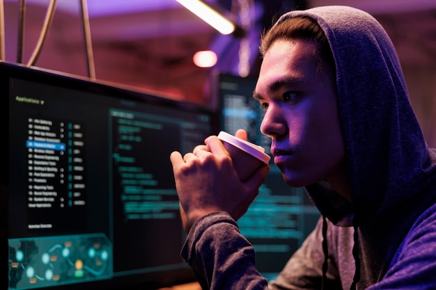 Free photo asian hacker drinking coffee