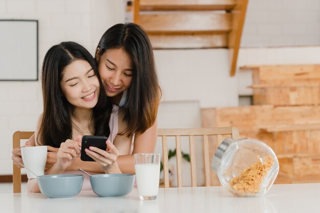 Asian Lesbian lgbtq women couple have breakfast at home