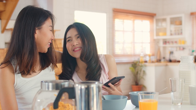 Asian Lesbian lgbtq women couple have breakfast at home