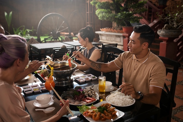 Asian people having dinner party