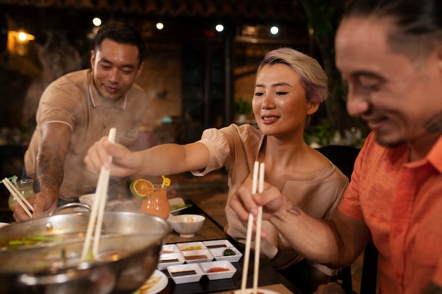 Asian people having dinner party