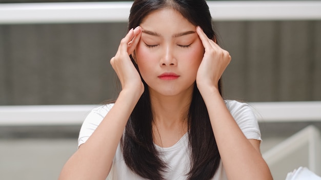 Asian student woman read books in library at university