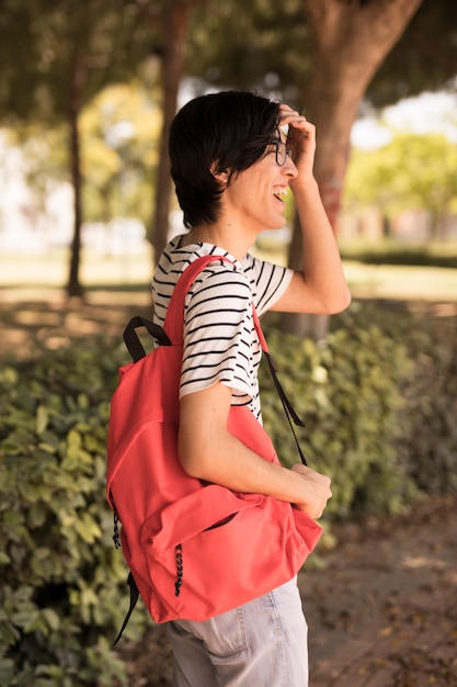 Free Photo asian teen man with backpack laughing