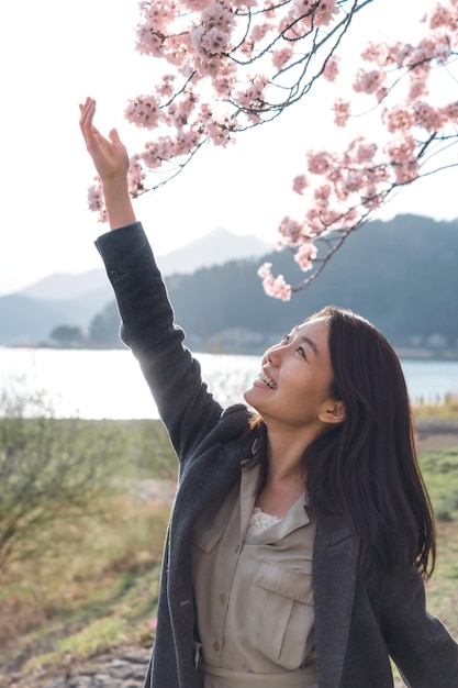 Asian woman appreciating the nature surrounding her